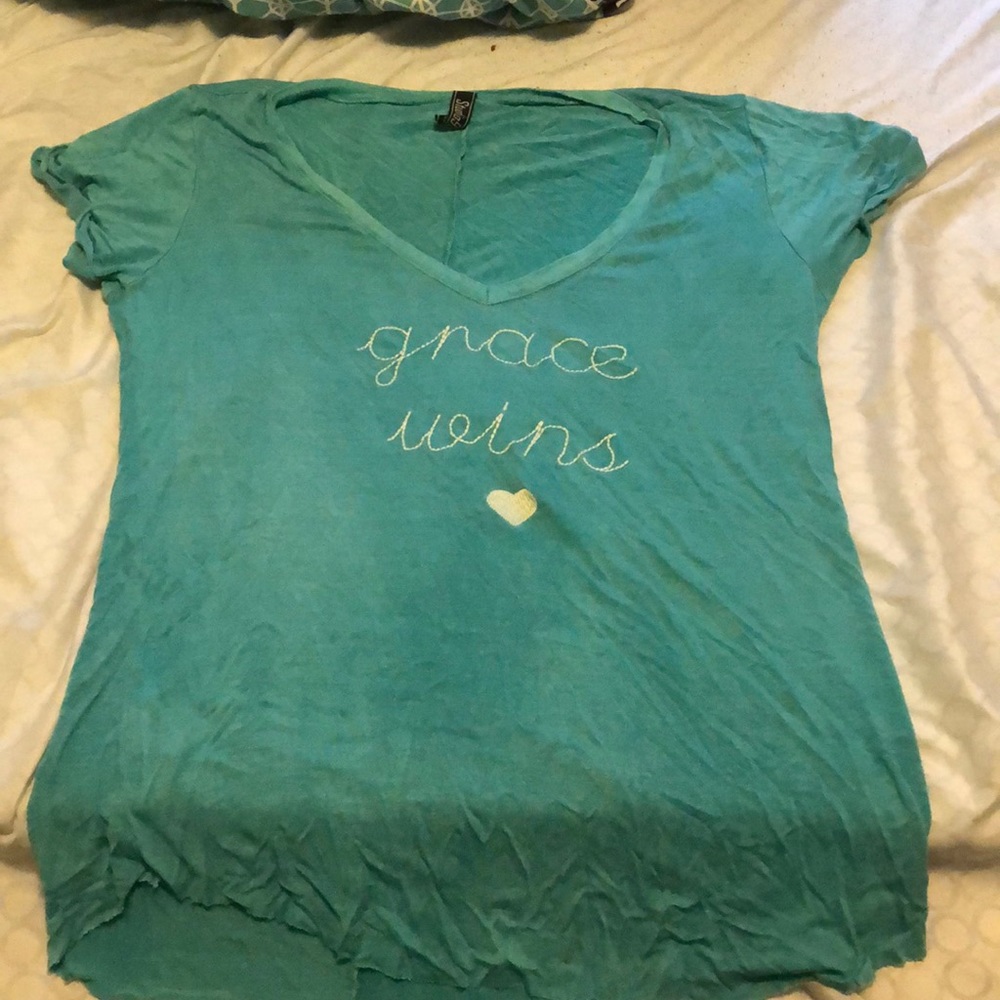 T-shirt says Grace wins